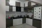 Modern L-Shaped Grey And White Kitchen Design With Cabinets