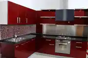 Modern Modular L-Shaped Parallel Red Kitchen Design With Patterned Dado Tiles