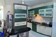 Modern White And Sea Green Indian Kitchen Design With Kitchen Triangle
