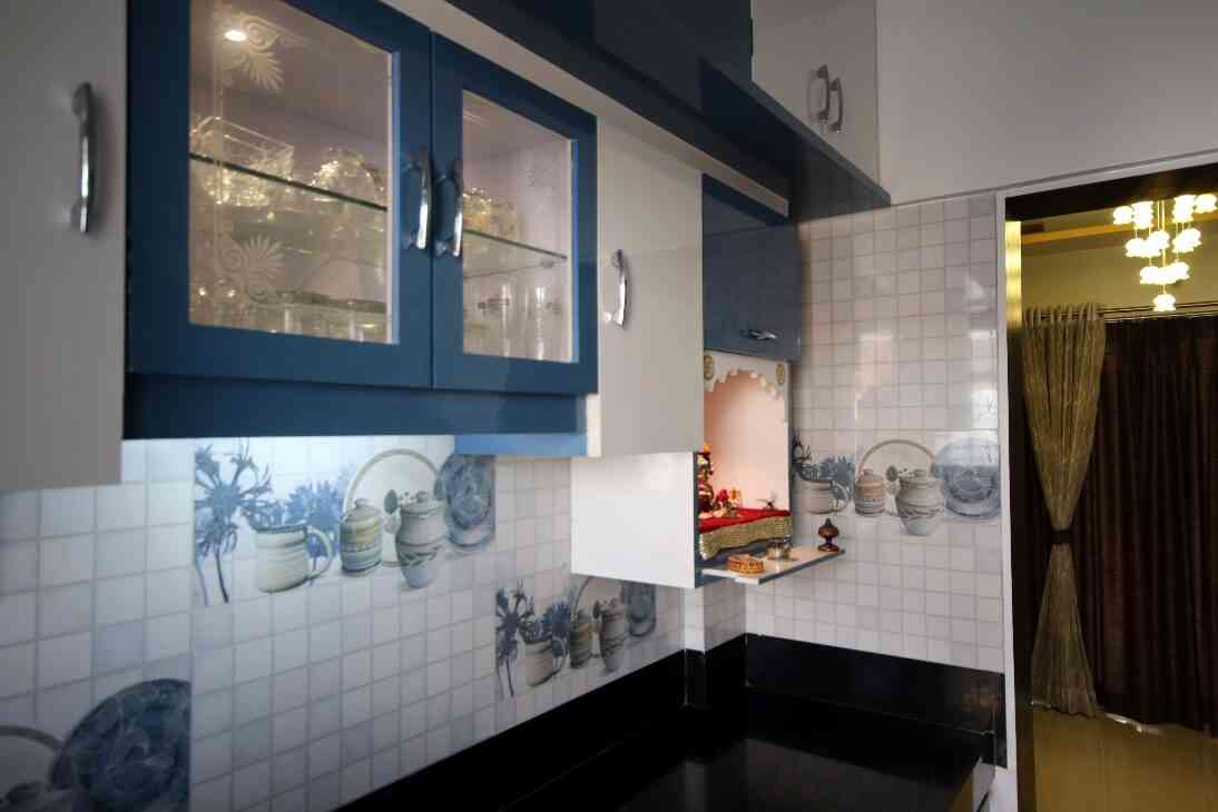 Simple Kitchen Design With Crockery Unit And Small Temple