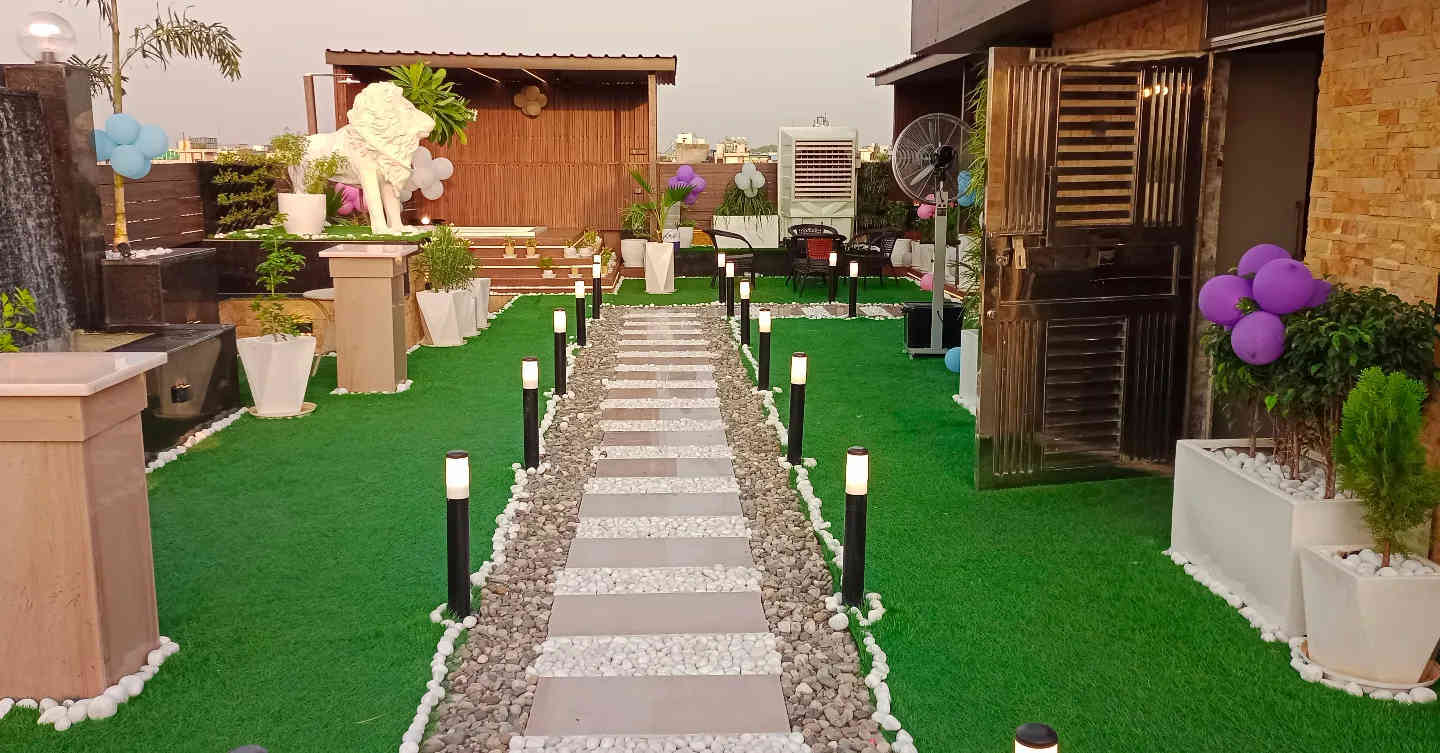 Luxurious Rooftop Garden with Illuminated Pathway