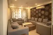 Modern Living Room Design With A Beige Color Sofa Set
