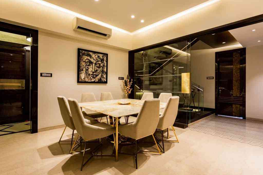 Modern Dining Room Design With Wall Art And Lighting