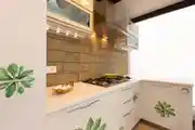 Modern L-Shaped Kitchen With Flower Print Cabinet