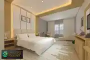 Modern And Spacious Bedroom With Golden and White Interiors