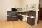 Modular L-Shaped Kitchen Design With White and Grey Display