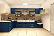 Classic Blue And Cream Toned L-Shaped Kitchen Design With Marble Dado Tiles