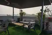 Stylish Rooftop Retreat with Greenery & Cozy Seating