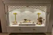 Elegant Traditional Pooja Room with Intricate White Carvings