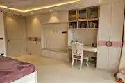 Elegant Bedroom with Study Area and Custom Storage Design