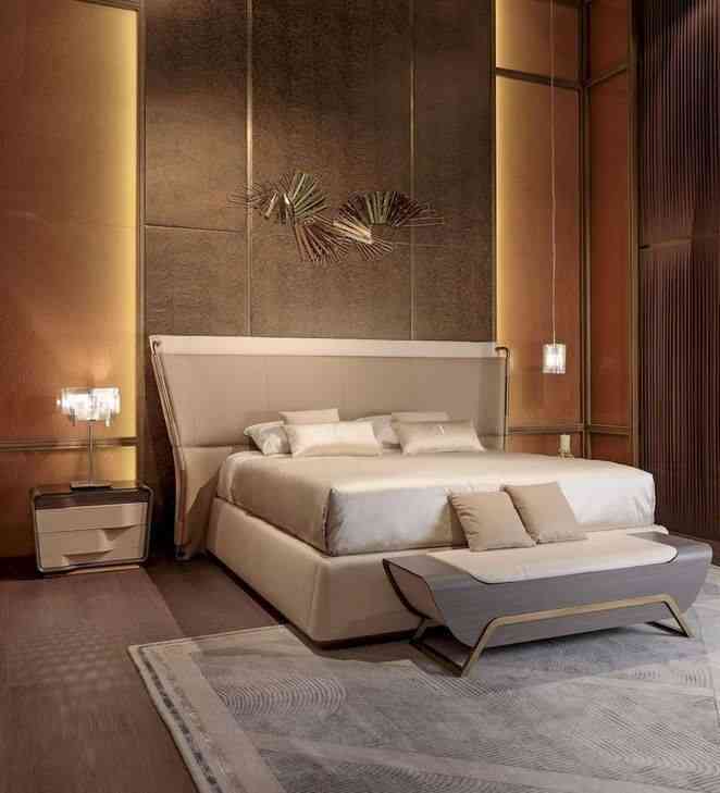 Modern Bedroom Design With A Double Bed And Golden Wall Panelling