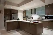 Contemporary Brown Modular Kitchen Design With White Marble Island