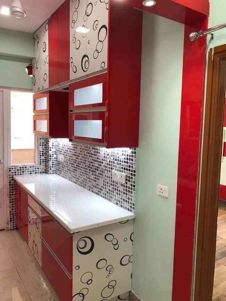 Modern Red And White Modular Kitchen With Glossy Cabinets