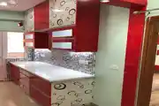 Modern Red And White Modular Kitchen With Glossy Cabinets