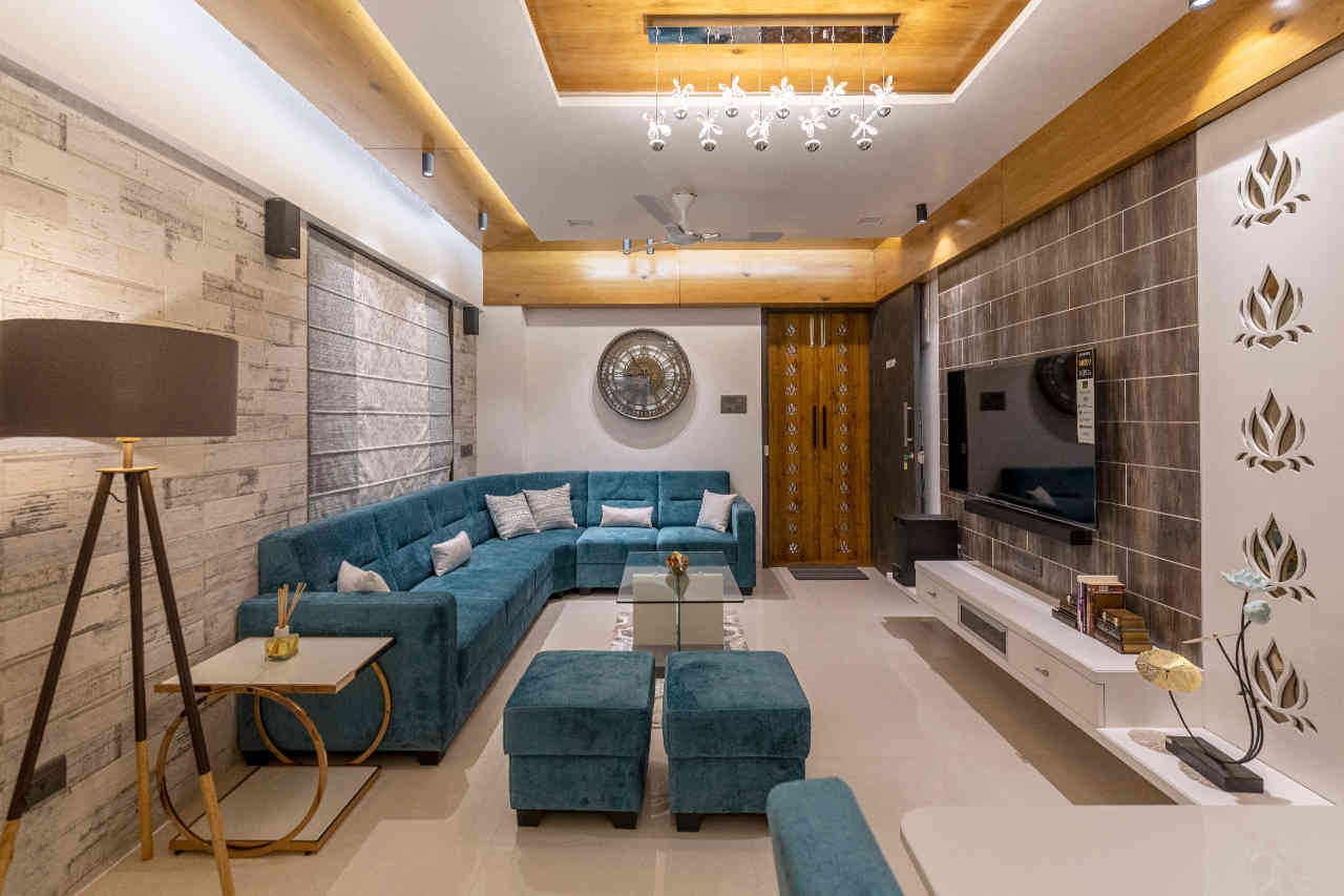 Contemporary Living Room Design With Wall Lights And A Chandelier