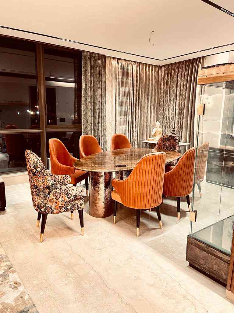 Contemporary 8-Seater Marble Dining Room Design With Orange Chairs