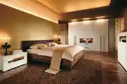 Golden Accent Bedroom With White Glossy Wardrobe
