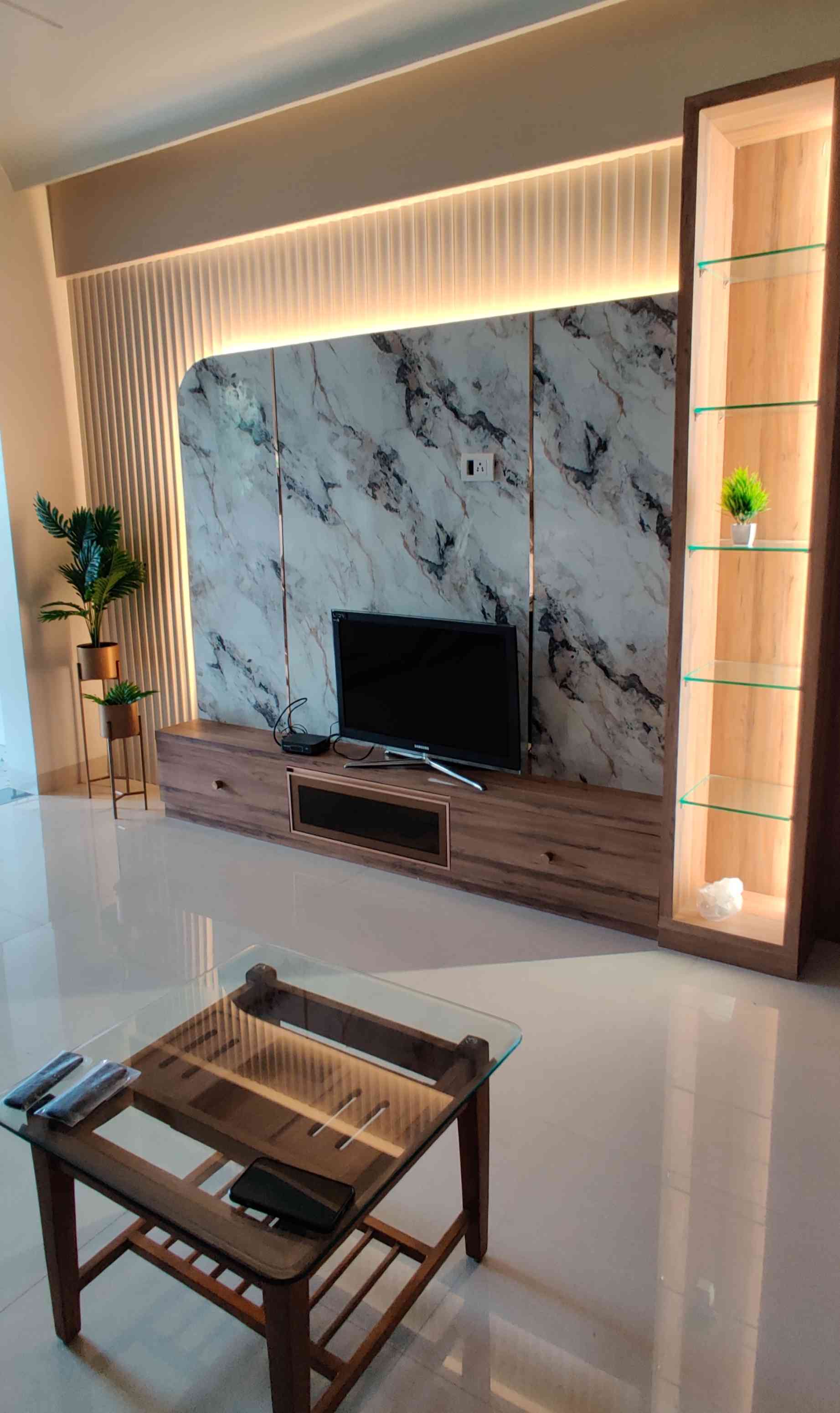 Stylish TV Unit with Marble Finish and Warm Lighting