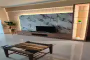 Stylish TV Unit with Marble Finish and Warm Lighting