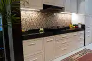 Elegant Modular Kitchen with Sleek Black Countertop