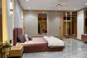 Elegant Modern Bedroom with Plush Accents and Sleek Wardrobe Design