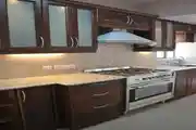 Modular Kitchen Design With Dark Wood & Laminate Cabinets