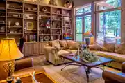 Rustic Cozy Living Room with Wooden Bookshelves and Warm Interior Design