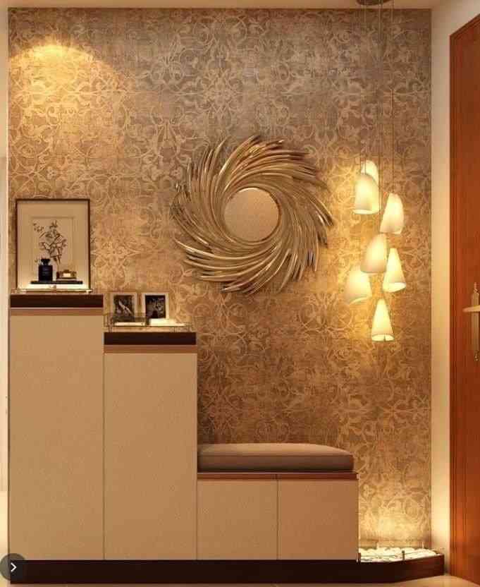 Sophisticated And Modern Foyer Design With Luxurious Gold-Accented Mirror