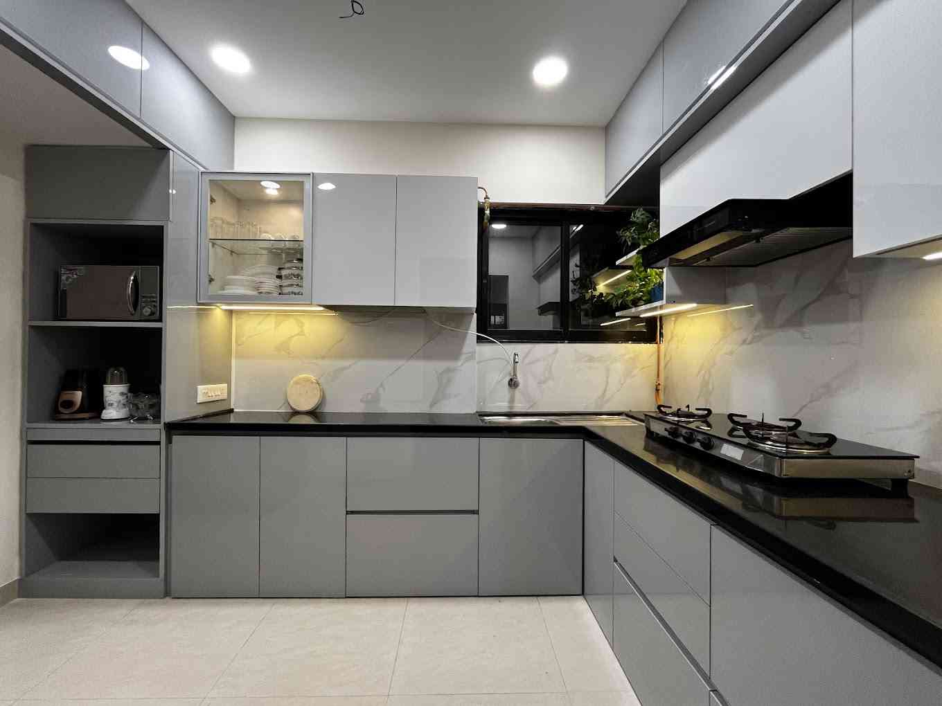 Sleek And Modern Modular Kitchen With Glossy Grey Cabinets