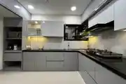 Sleek And Modern Modular Kitchen With Glossy Grey Cabinets