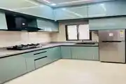 Sleek And Modern Modular Kitchen Design With Glossy Aqua Blue Cabinets