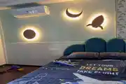 Dreamy Space-Themed Kids' Bedroom With Glowing Wall Lights 