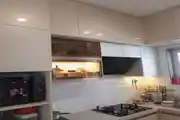 Modern Modular Kitchen Featuring Glossy Overhead Cabinets