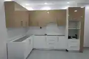 Modern Modular Kitchen in Progress, WithSleek Combination of Glossy Beige