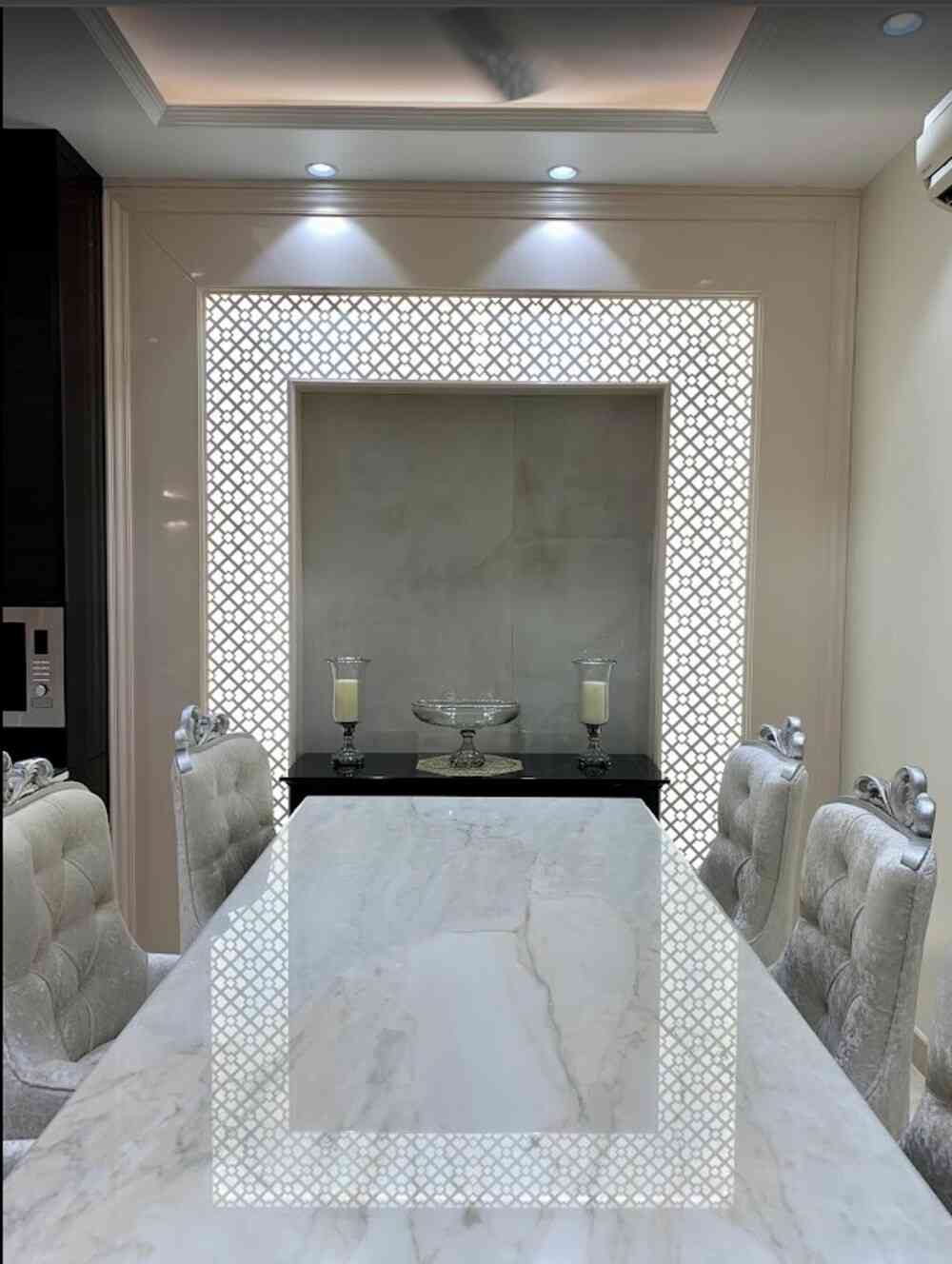 Dining Space With Luxe Marble Table And Tufted Velvet chairs