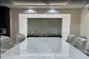 Dining Space With Luxe Marble Table And Tufted Velvet chairs
