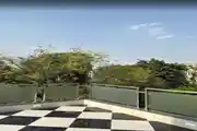 Serene Terrace Corner With Bold Black-And-White Checkered Floor