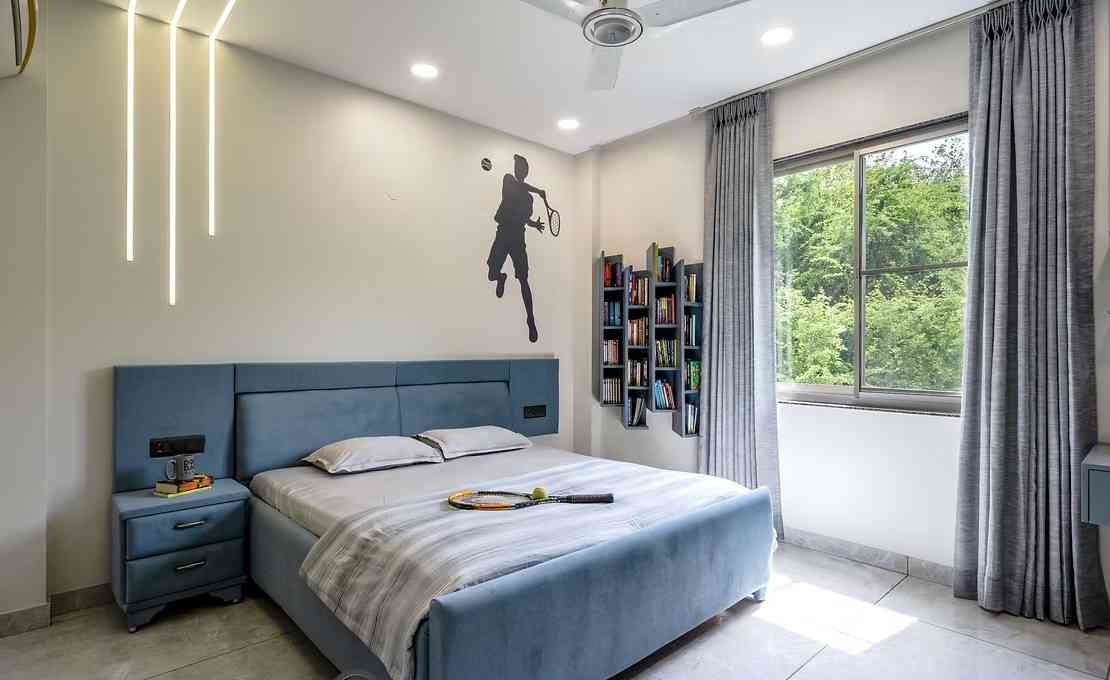Vibrant Bedroom Blends Soft Tones With Modern Lighting And Playful Decor